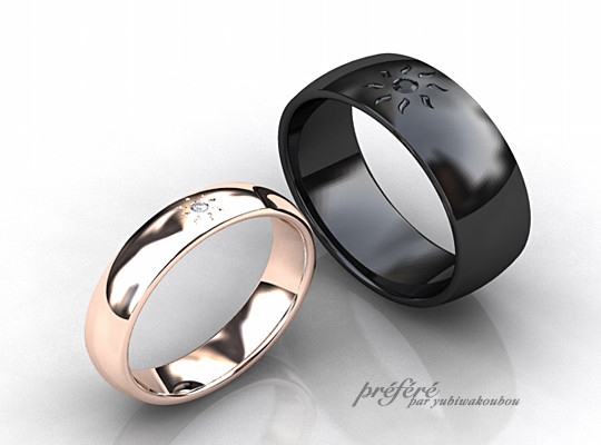 太陽モチーフの結婚指輪 ピンクゴールドの甲丸に白いダイヤ ブラック仕上げの巾広甲丸形状にはブラックダイヤ